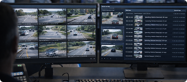Dual-monitor setup displaying traffic camera footage and vehicle speed data